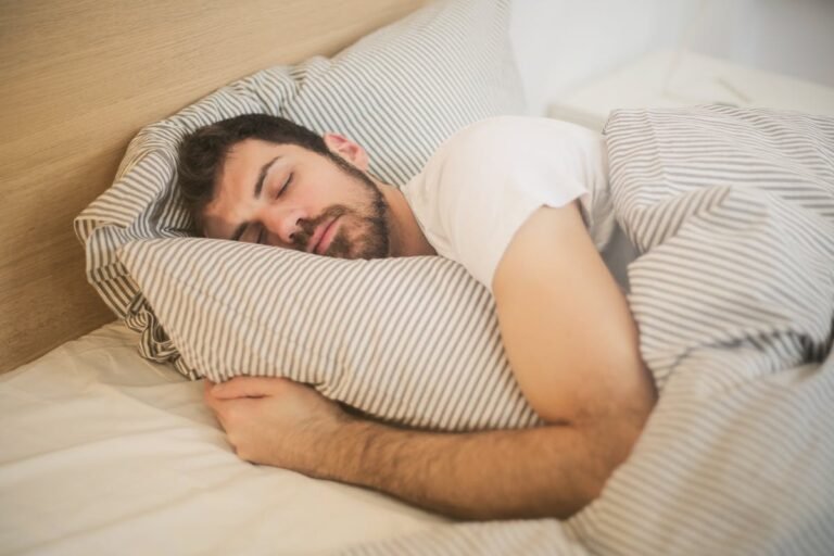 Person with insomnia lying awake at night sleep problems